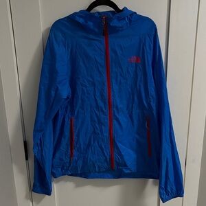 The North Face Vibrant Blue windbreaker Jacket with Red Accents